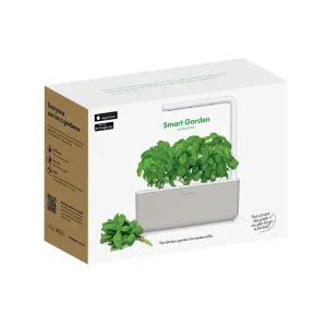 Boîte du kit de démarrage Click & Grow Smart Garden 3 présentant l’unité de jardin d’herbes aromatiques d’intérieur avec des plants de basilic et des badges d’application