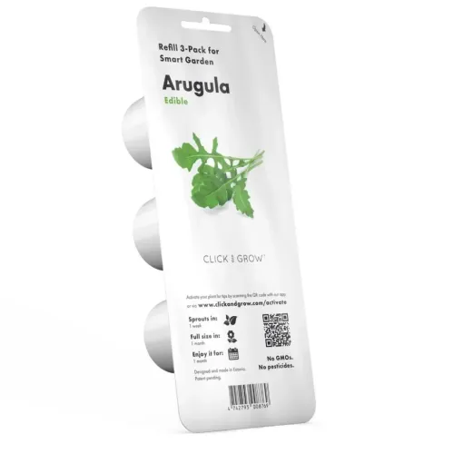 Vit blisterförpackning för Click & Grow Arugula 3-pack, visad i sned vinkel med tre runda kapslar, hänghål, QR-kod, örtbild.